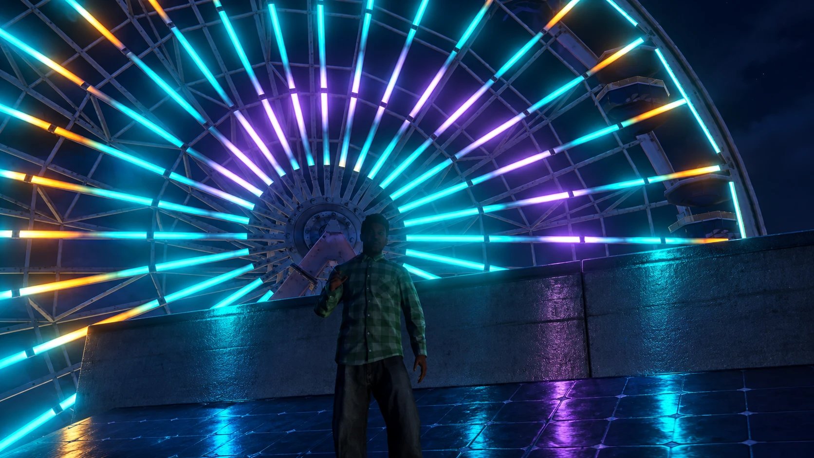 Un joueur en chemise à carreaux devant la grande roue illuminée